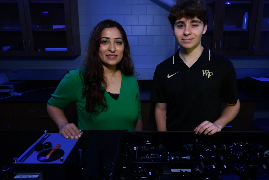 Elham Ghadiri and Dan Doughan with Intricate Laser Instument